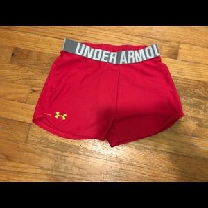 Bright pink Under Armour child’s gym shorts